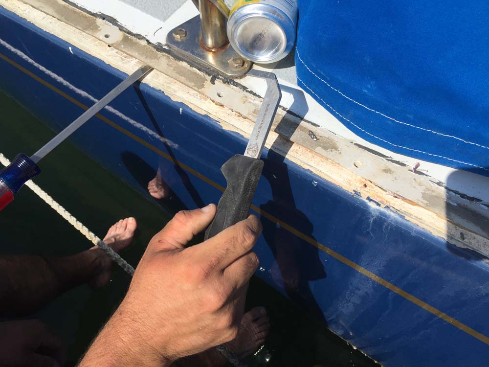 Boat Project Removing, rebedding and resealing the toerail and hulldeck joint (in Portland